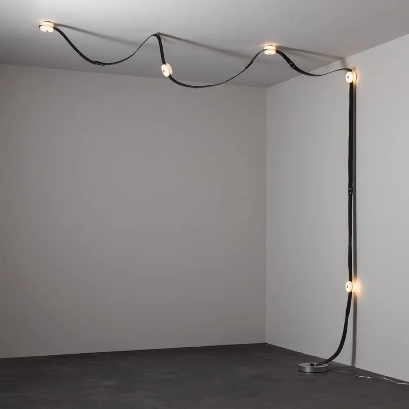 Plafonnier suspendu design moderne style artistique éclairage salon salle à manger lumière chaleureuse flexibilité déco intérieure