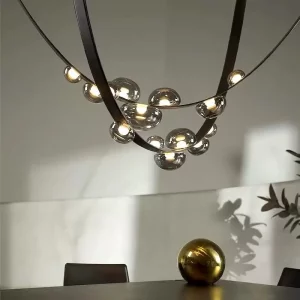 Suspension design moderne en verre et métal lumière diffuse éclairage contemporain salon salle à manger intérieur élégance ambiances chaleureuses